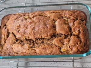 pan of hearty whole wheat banana bread on cooling rack