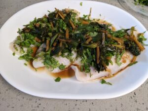 ginger sauteed with soy sauce and poured over steamed white fish filet