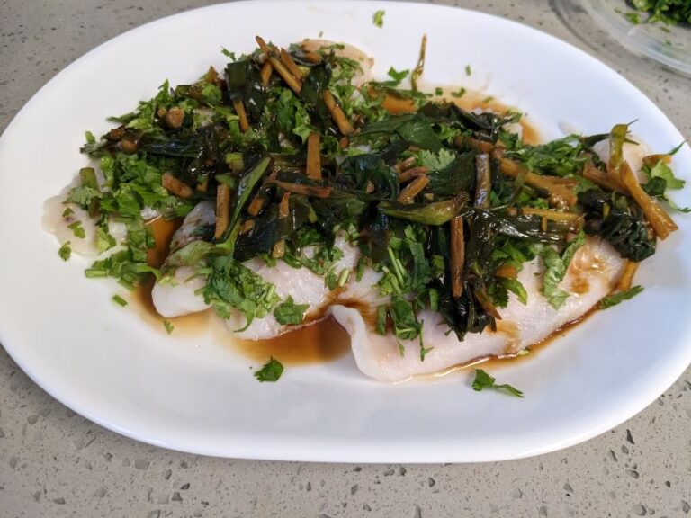 ginger sauteed with soy sauce and poured over steamed white fish filet