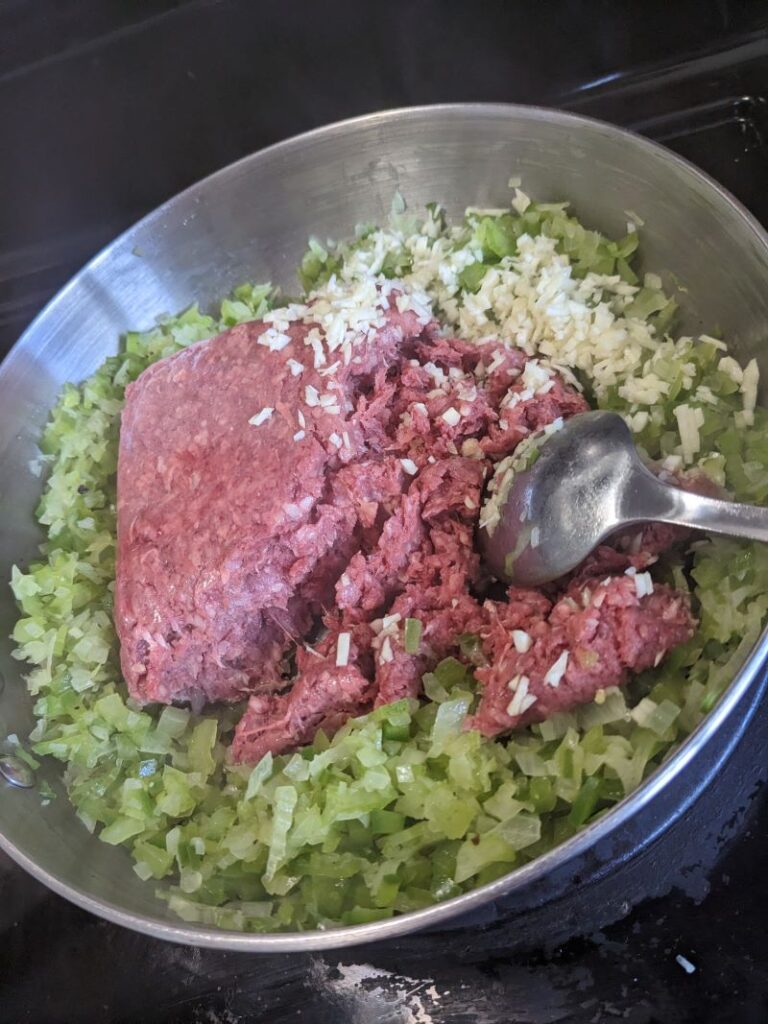 ground beef with vegetables in pan for sloppy joes