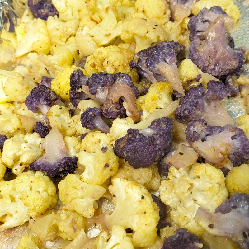 white and purple cauliflower roasted in the oven