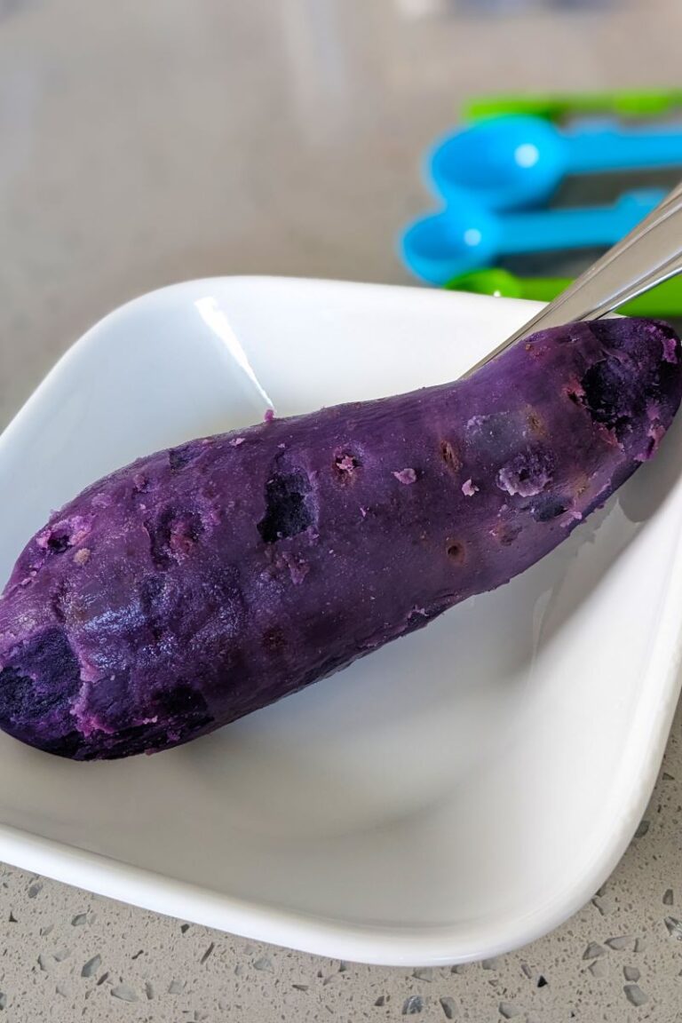 photo of a cooked okinawan sweet potato with skin peeled off