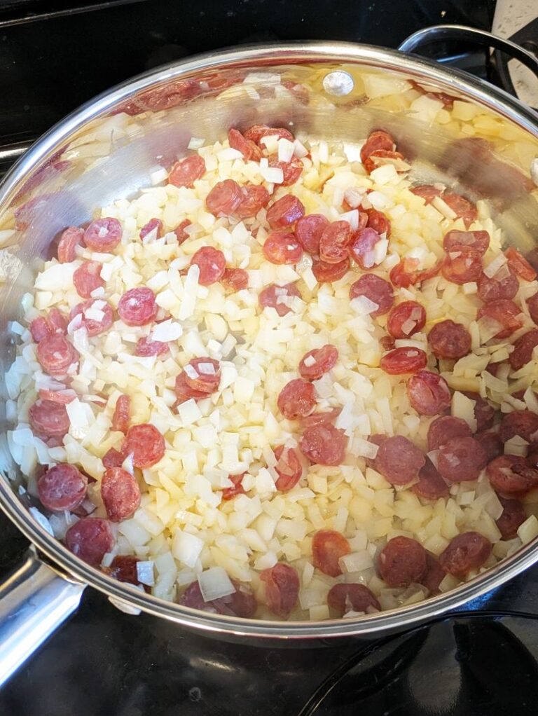 Chinese sausage, onions, and water chestnuts in pan