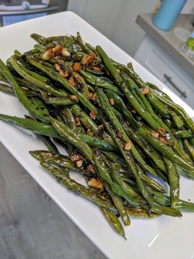 plate of roasted garlic and green beans