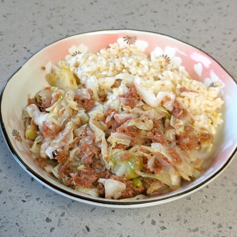 plate of canned corned beef and cabbage with rice