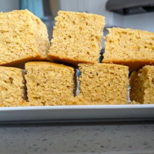 moist whole wheat cornbread stacked on a plate