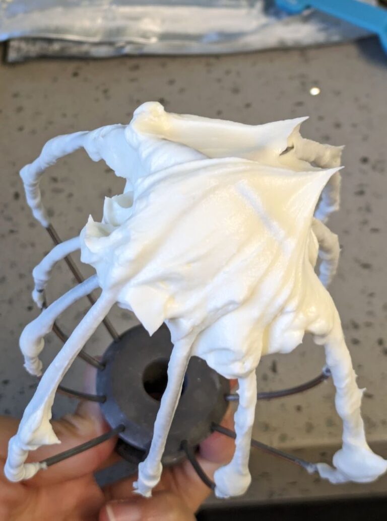 whipped cream cheese filling on whisk