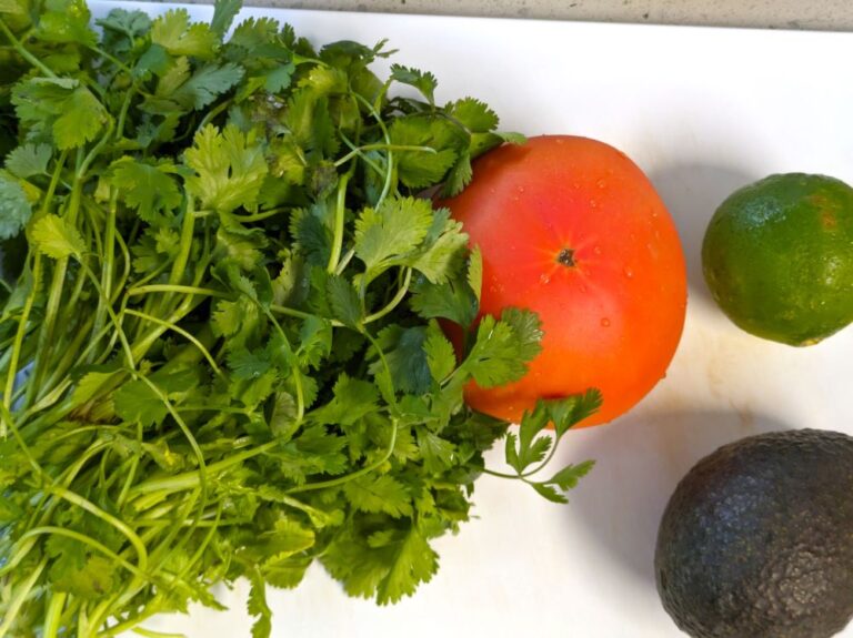 cilantro, tomato, lime, and avocado for corn and black bean salad