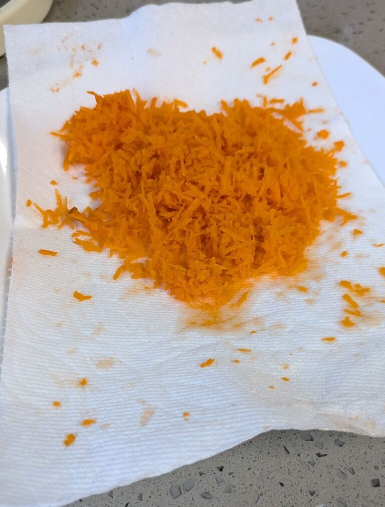 grated carrot drying on paper towel for Chinese cabbage slaw