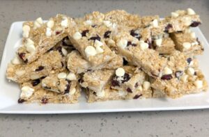 cranberry white chocolate macadamia energy bars on a plate