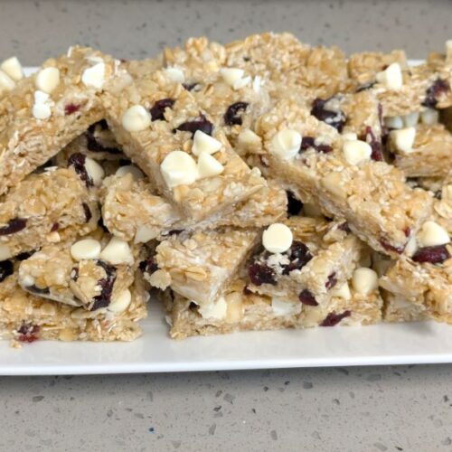 cranberry white chocolate macadamia energy bars on a plate