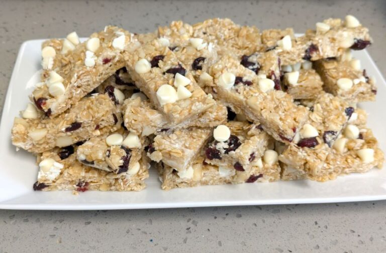 cranberry white chocolate macadamia energy bars on a plate