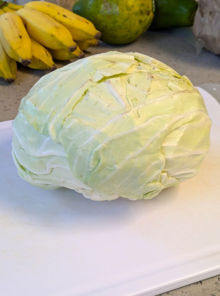 a head of cabbage for banchan on a cutting board