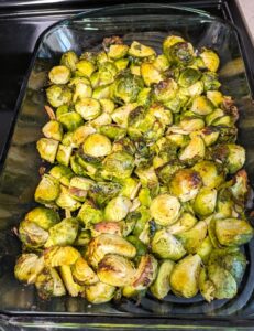 roasted brussels sprouts in a glass baking pan