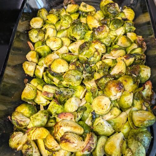 roasted brussels sprouts in a glass baking pan